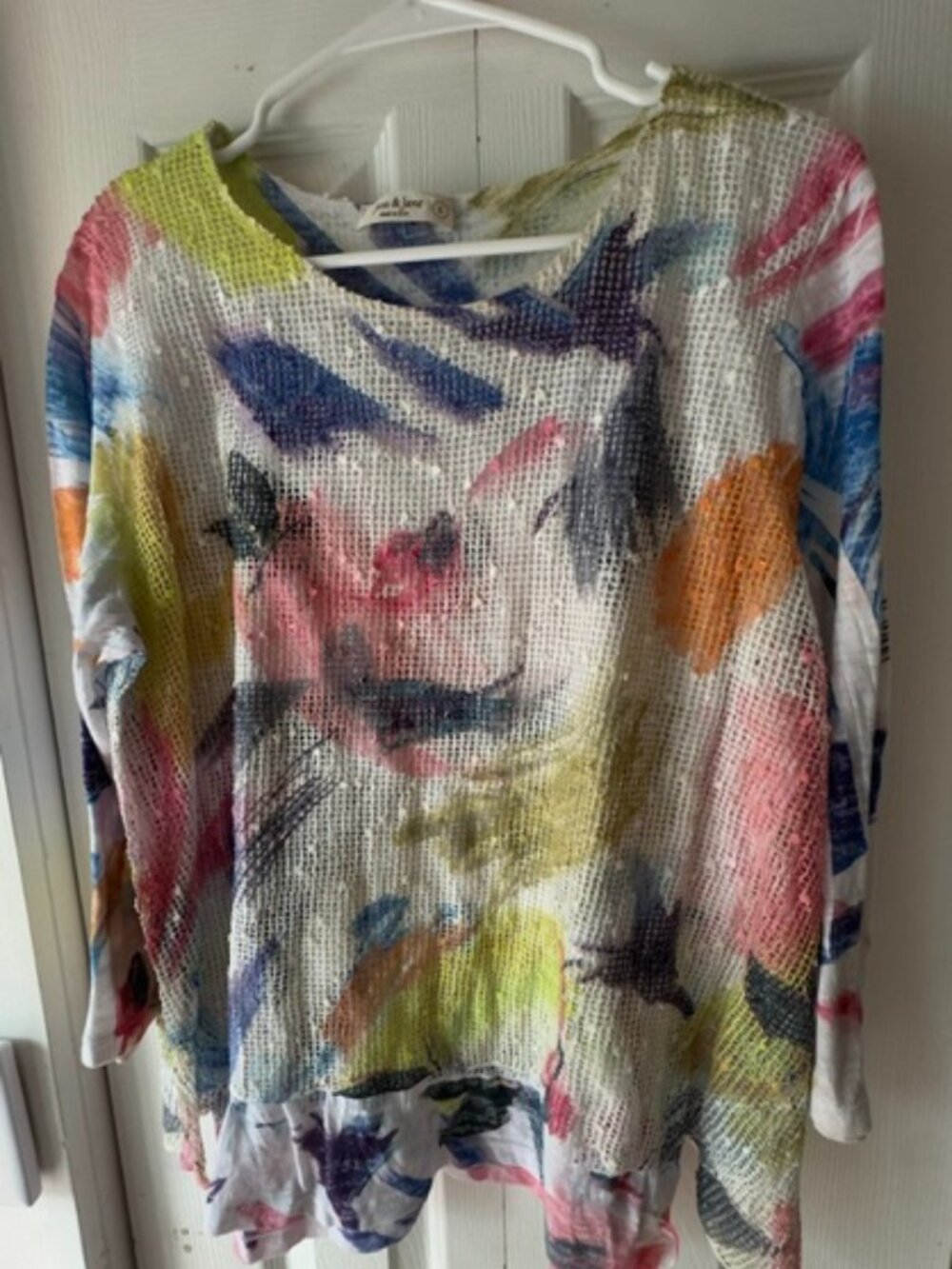 Women's top with knit overlay